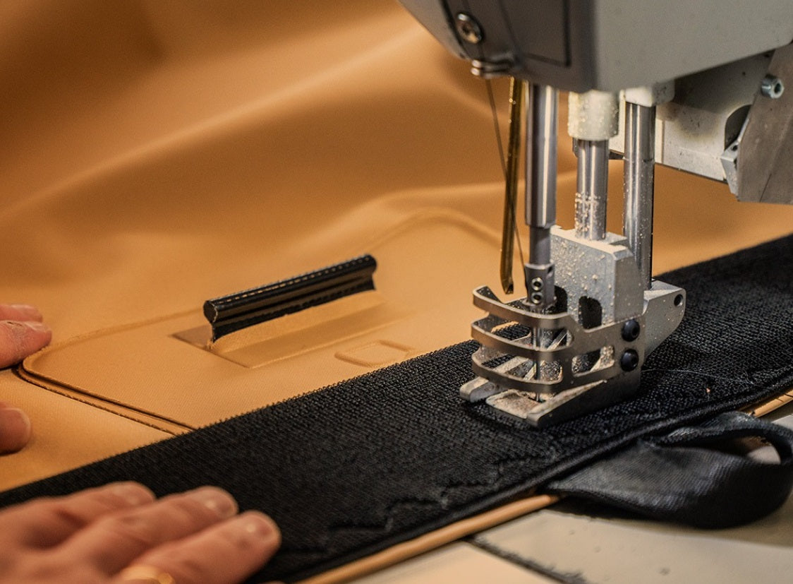 Close-up of stitching and fabric construction on a stretch tent sewing machine