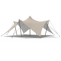 White stretch tent shown fully assembled with poles and tension lines