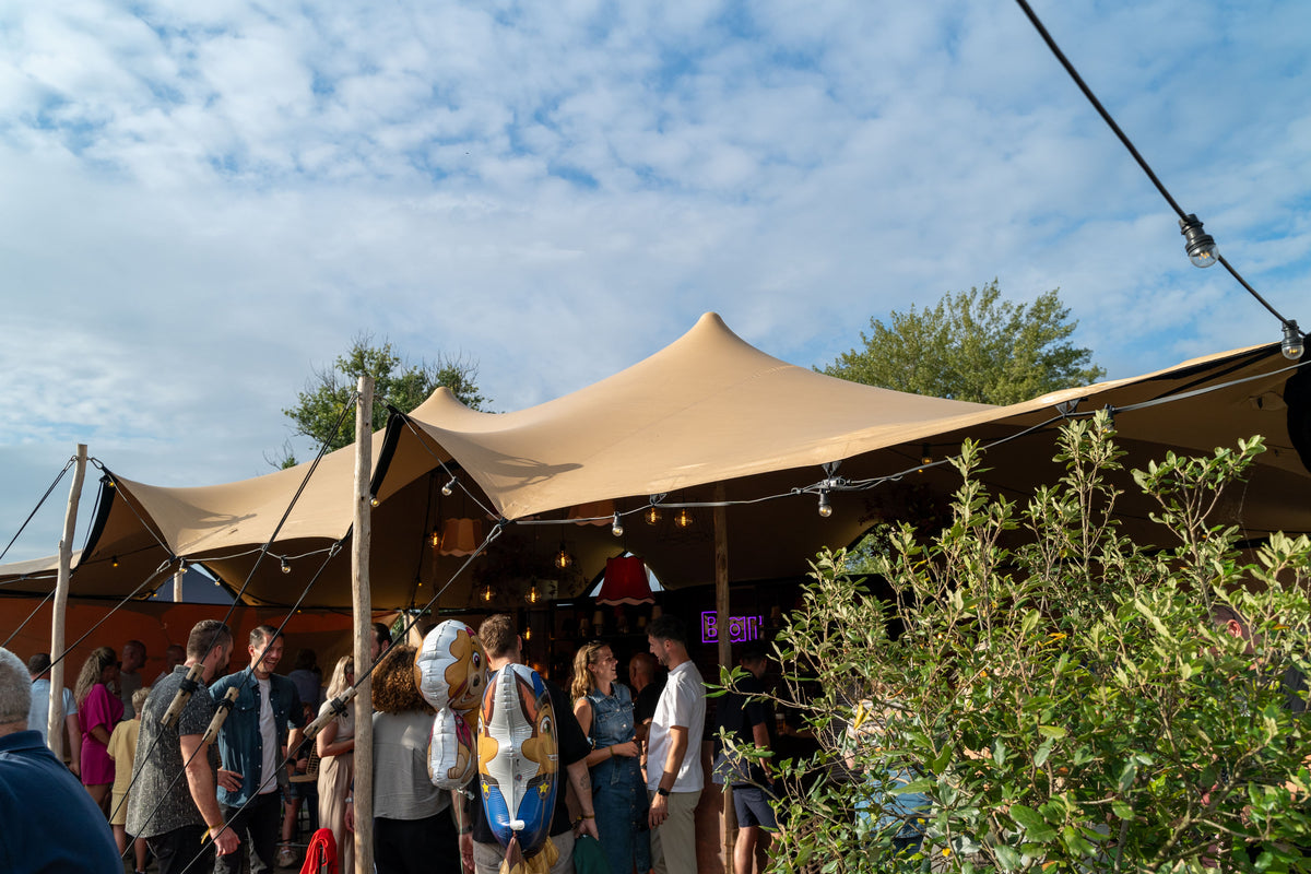 Outdoor festival with stretch tents